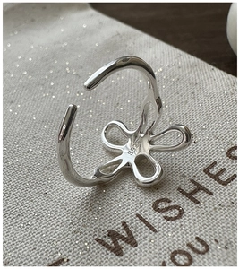 Close-up of S925 sterling silver floral ring showing the hallmark engraving