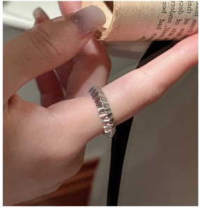 Macro view of S925 sterling silver ring with irregular geometric textured finish