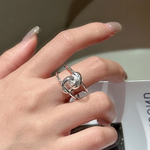 Minimalist S925 sterling silver double-layered knotted ring shown on a finger