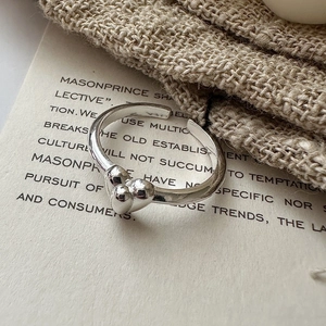 Minimalist S925 sterling silver open ring with three 3D hearts on vintage paper background