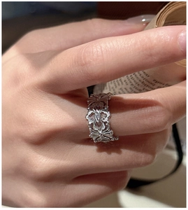 Detailed close-up of S925 silver iris flower ring with gothic floral relief engravings