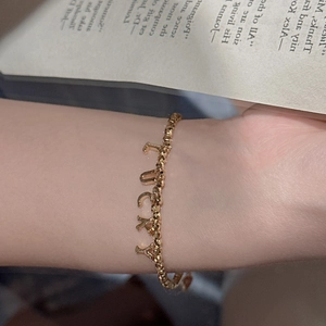 Minimalist S925 sterling silver beaded bracelet with LUCKY letter charms on wrist