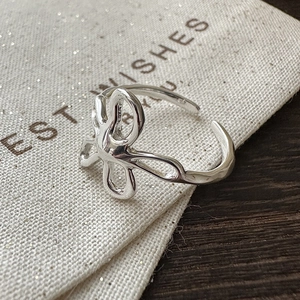 Modern S925 sterling silver open ring featuring an abstract floral and flowing water design