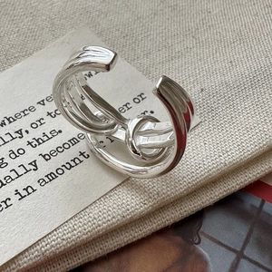 Adjustable S925 sterling silver ring featuring a modern multi-layer knotted design