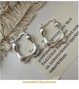 Detailed view of matte S925 sterling silver square hoop earrings with wavy texture