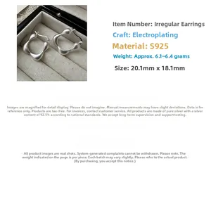 Macro detail of S925 sterling silver square hoop earrings with irregular matte texture
