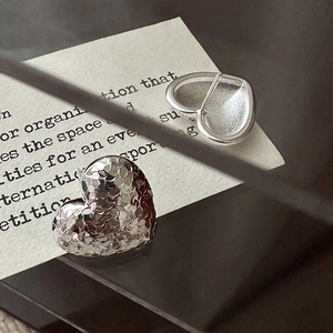 Minimalist S925 sterling silver heart earrings with textured scales and polished finish