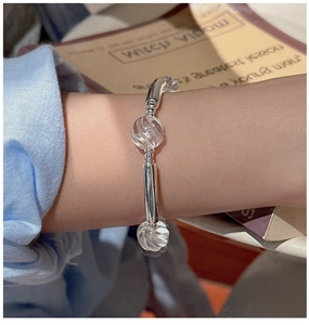 Close-up of S925 sterling silver bracelet with white crystals on a wrist