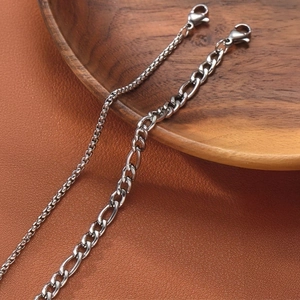 Minimalist double layer stainless steel chain bracelet set on vintage leather background