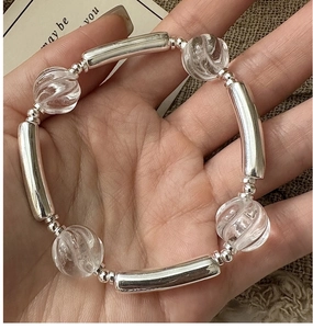 Detailed close-up of S925 silver beaded bracelet with white crystal and vintage metal tubes