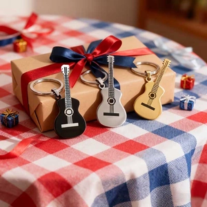 Guitar keychain set in black, silver, and gold metal finishes with a gift box presentation