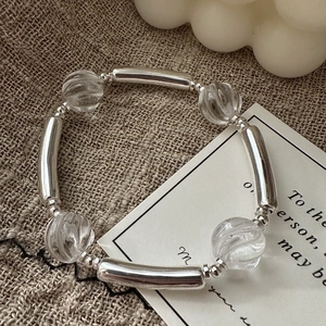 S925 sterling silver beaded bracelet with clear crystal beads on rustic linen fabric