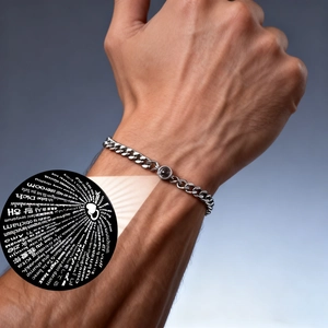 Macro detail of silver projection bracelet with 'I Love You' in 100 languages on the stone