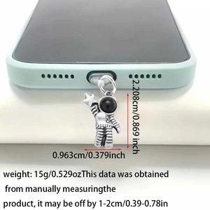 Detailed view of alloy astronaut phone dust plug with measurements on green smartphone