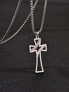 Macro view of silver cross pendant with baseball stitch detail and sturdy box chain link