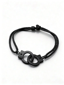 Detail of black woven rope bracelet with interlocking matte handcuffs charm for unisex style