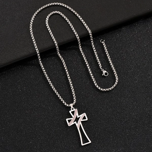 Silver stainless steel baseball cross necklace with red stitching on black background