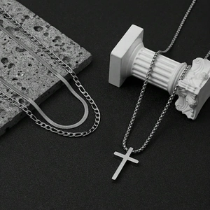 Three-piece stainless steel necklace set with cross pendant and layered chain style