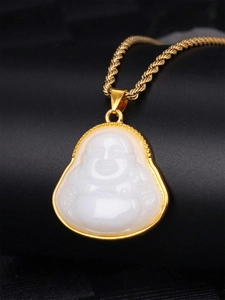 Macro shot of laughing Buddha pendant with white jade-like stone and gold finish
