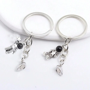 Magnetic astronaut couple keychains in vintage silver finish with stars for gift