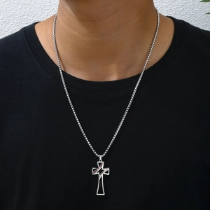 Men's titanium steel cross necklace with baseball stitch pattern on black t-shirt