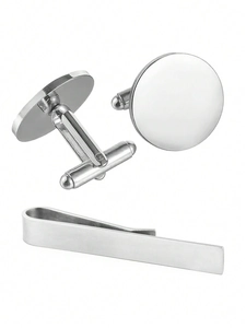 Detailed macro view of silver stainless steel cufflinks and brushed tie clip set