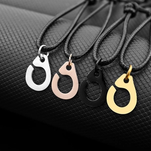 Macro shot of horseshoe clasp bracelets in silver, rose gold, black, and gold metal finishes