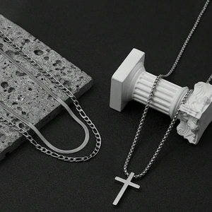 Three-piece stainless steel necklace set with cross pendant and layered chain design