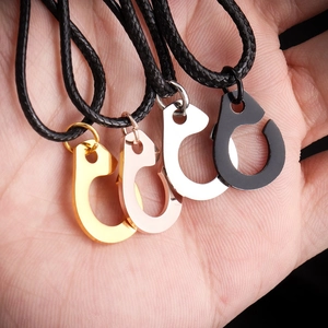 Detailed view of titanium steel handcuff charms in four colors with black woven cords