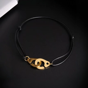 Minimalist titanium steel black woven rope bracelet with gold interlocking handcuff clasp