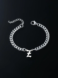 Detail of gothic letter Z pendant on stainless steel cuban link bracelet with lobster clasp