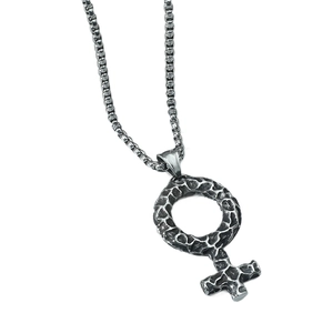 Vintage silver Venus symbol pendant necklace with textured hammered finish on white background