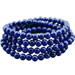 Detailed view of multi-layered navy blue lapis lazuli beads with natural golden flecks