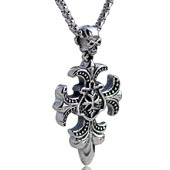 Macro shot of silver retro dumbbell pendant featuring skull and fleur-de-lis cross design