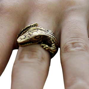 Detailed view of crocodile ring with vintage gold finish and realistic scale texture