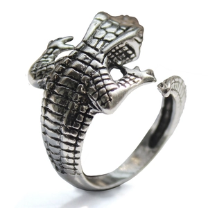 Detailed macro view of vintage crocodile ring showing lifelike silver scale textures