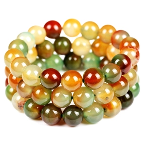 Close-up of polished 8mm colorful lava stone and quartz beaded multi-layer bracelet
