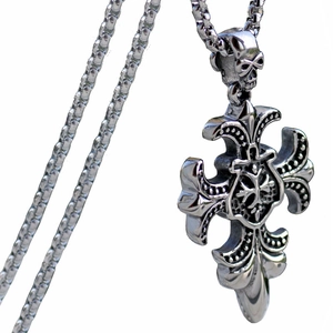 Detailed view of Gothic cross pendant with skull bail on stainless steel chain