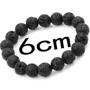 Detail of black lava stone beaded bracelet showing 6cm inner diameter and mineral texture