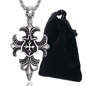 Detailed view of silver gothic cross pendant with skull design and velvet pouch