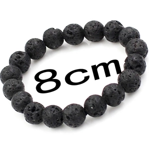 Detailed view of 8cm black volcanic lava stone bead bracelet with porous texture