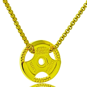 Detailed macro of golden dumbbell plate pendant with engraved inspirational text