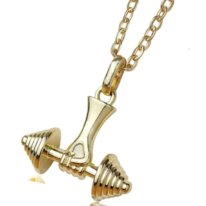 Detailed close-up of a gold-plated dumbbell pendant featuring hand grip and screw thread texture