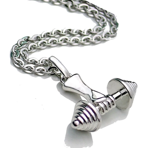 Macro shot of silver dumbbell pendant with detailed texture on metal link chain