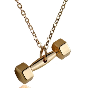 Close-up of polished gold dumbbell pendant necklace for women with minimalist finish