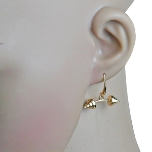 Golden fitness dumbbell hook earring displayed on model for gym enthusiasts
