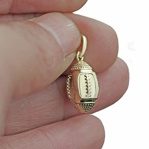 Detailed view of an 18K gold American football pendant necklace with realistic textures