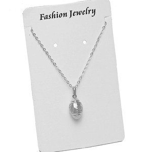 3D American football pendant necklace in silver finish on jewelry card with chain