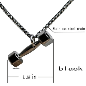 Macro view of black stainless steel dumbbell pendant showing 1.38 inch width dimension