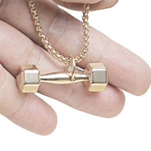 Polished gold dumbbell pendant necklace for men with a matching box chain accessory
